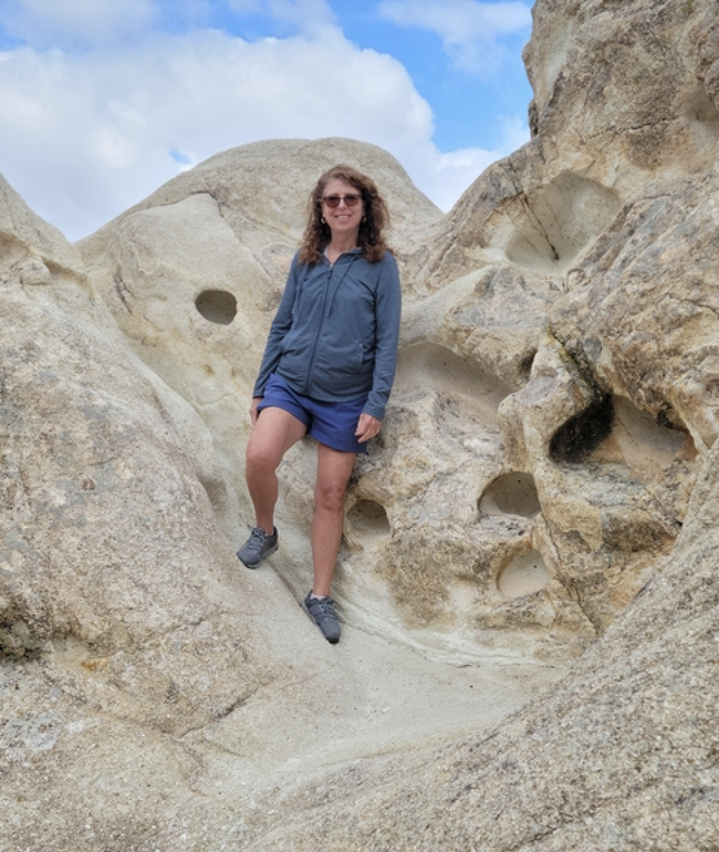 Woodward-Lopez stands on rock formation in Cappadocia, Turkey