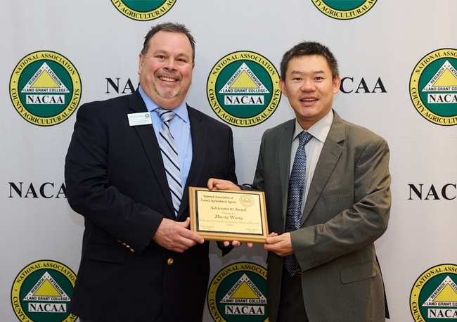 Zheng Wang accepts the California Achievement Award for extension professionals with less than 10 years of service.