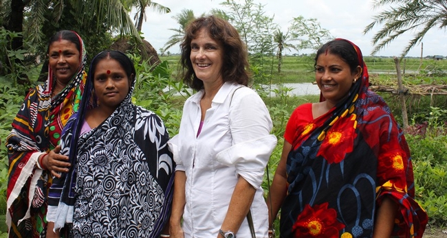 Beth Mitcham, second from right, shown with women in Bangladesh who are using the chimney solar dryer (designed by UC Davis faculty) to preserve fruits and vegetables from their homestead gardens. Photo by Amanda Crump.