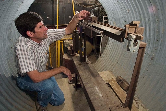 Retired pomologist Scott Johnson in the underground access chamber of the weighing lysimeter.
