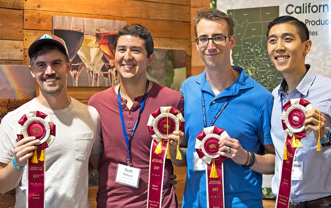 From left, Calvin Doval, Scott Kirkland, John Knoll and Shiang-Wan Chin's Greener app, which diagnoses plant diseases from a photo, took second place.
