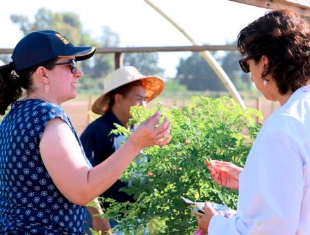 Ruth Dahlquist-Willard shows Estolano moringa and describes her work to connect disadvantaged farmers with resources to improve their businesses.