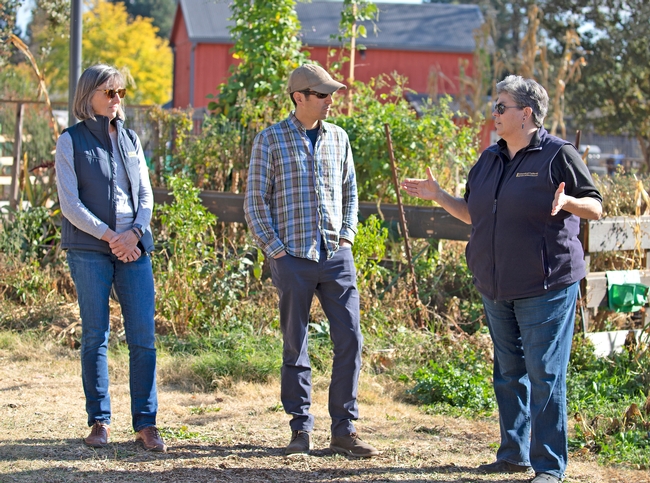From left, Regent Stegura and Michael Bedard talk with Glenda Humiston at Bayer Farm Park and Gardens.