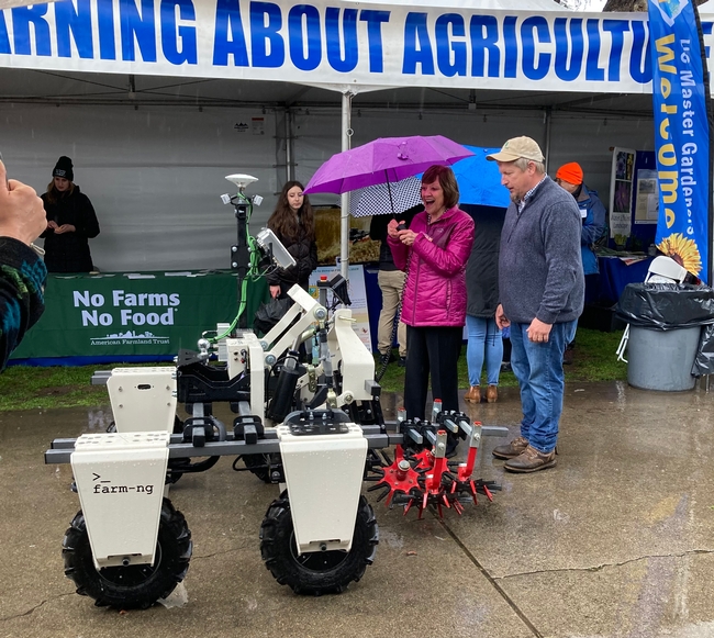 Karen Ross test drives a farm robot.