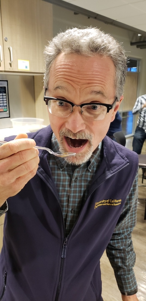 UC Integrated Pest Management directort Jim Farrar eats a bug for breakfast to show his commitment to the program.