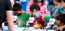 Children look into microscopes during North Bay Science Discovery Day, cosponsored by UC Cooperative Extension. Photo by Evett Kilmartin for ANR news releases Blog