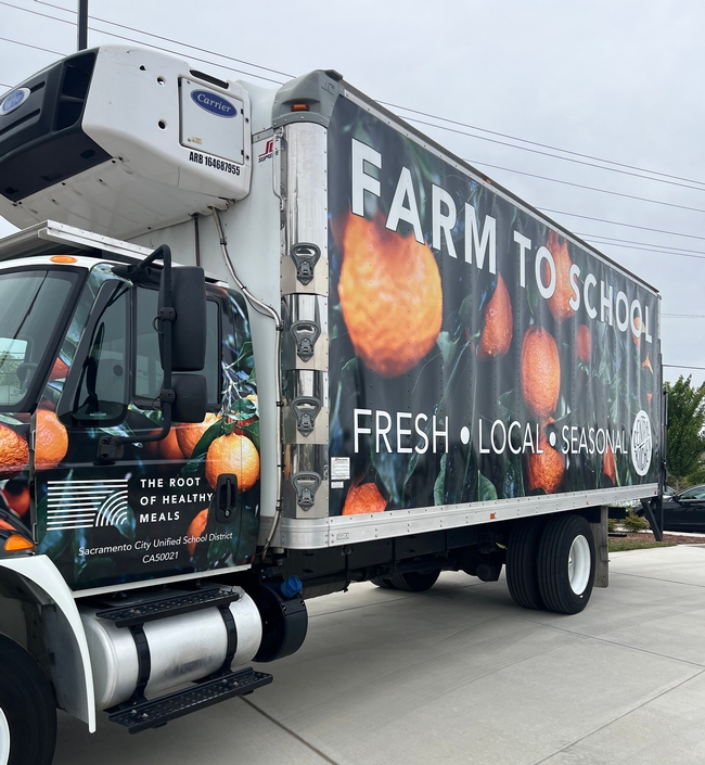 Refrigerated truck reads: Farm to School. fresh. local. seasonal.