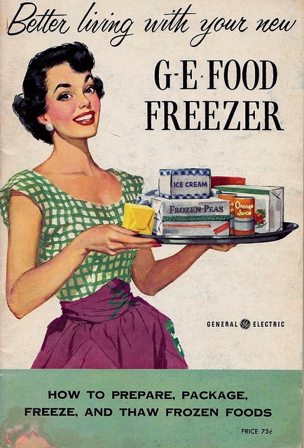 GE Freezer Poster ad, circa 1960, of woman with tray of frozen food products
