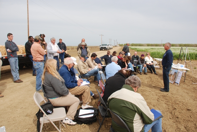 Farmers gather for training at a previous conservation agriculture field day. A half-day workshop titled 'Benefits of Soil Management for Farming Systems