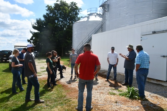 CASI’s Monte Bottens, President of ANP in Moline, IL, and farmer with his dad, Bob Bottens, at Bottens Family Farm in Sherrard, IL hosting a group of California Ag Solutions visitors and Jeff Mitchell on July 31, 2019