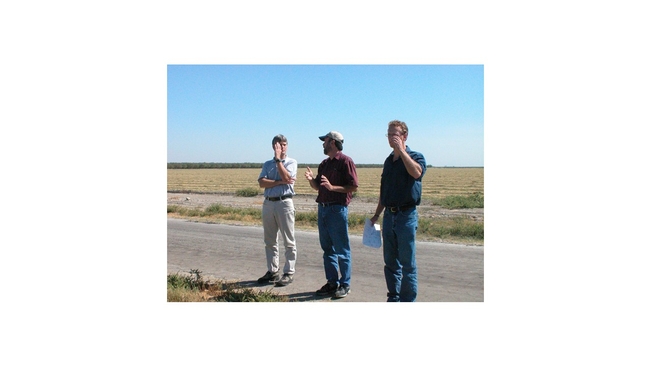 Picture 2.  Randy Southard, Rob Roy and Nick Madden discussing dust monitoring plans at Rollin Valley Farms, 2004