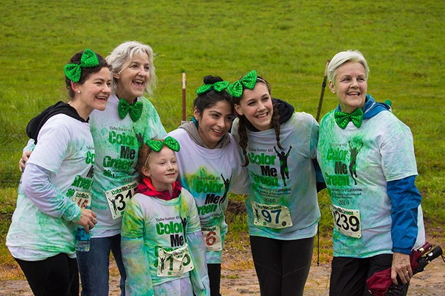 Participants of all ages in a Color Me Green Run
