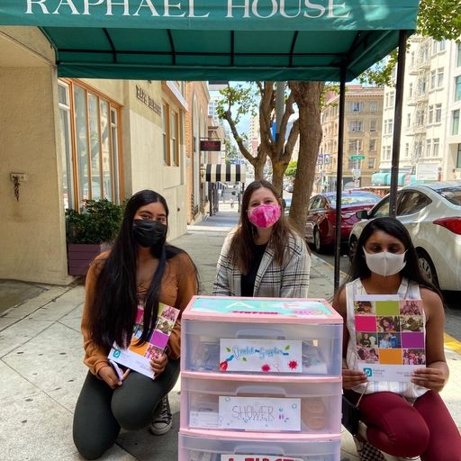 Sudarsan and her team delivering a baby hygiene cart to Raphael House in San Francisco.