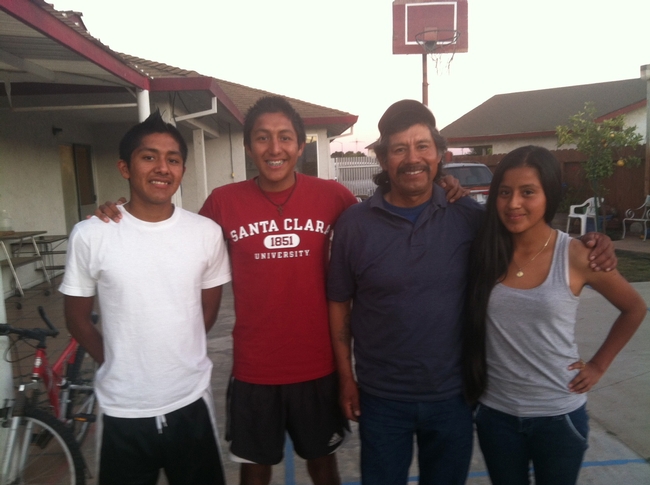 Eleazar Sosa, second from right, told Buter he hopes his son (second from left) acquires experiences that will lead to a career beyond farmwork. The three youths in the picture are Sosa's children, left to right, Roosevelt, Randy and Jocelyn.
