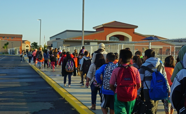 Students arrive at Virginia Lee Rose Elementary School.