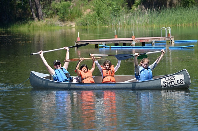 Stephanie, a teacher from Mills Middle School in Rancho Cordova, and happy paddlers are all smiles. Though learning is paramount at 4-H On the Wild Side, fun is never compromised. (Photo: Marianne Bird)