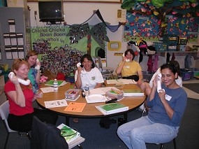 Parents of preschoolers practice using sound-a-phones they made as part of the Off to a Good Start series.