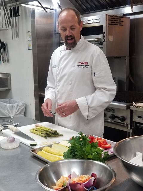 Chef Jeff sharing the ingredients for grilled salad.