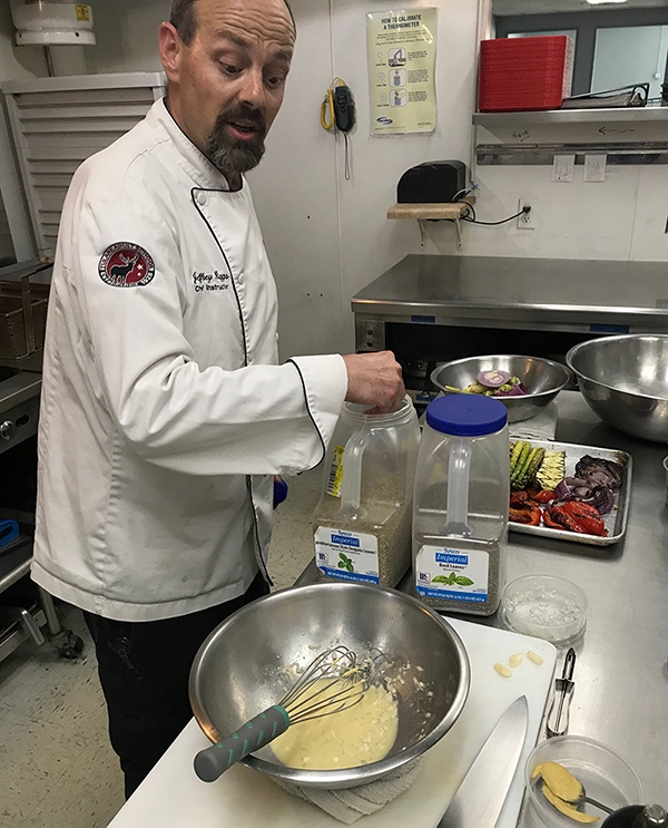 Chef Jeff demonstrating how to make a healthy vinaigrette.