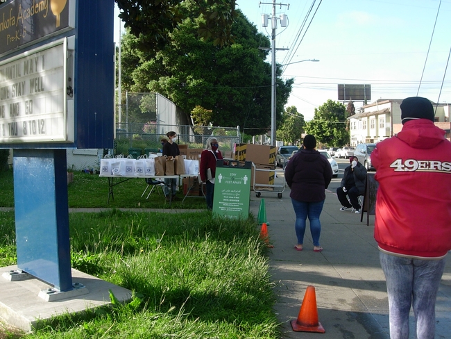 Parents practiced social distancing while picking up plants in Oakland.