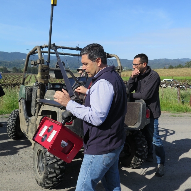 two researchers and an ATV with cameras mounted