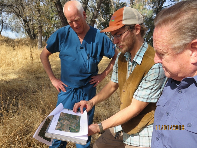 NRCS Soil scientist Andrew Brown (in cap) shows Tuolumne property owner Tim Moreno and Tuolumne Supervisor John Gray the soil map.
