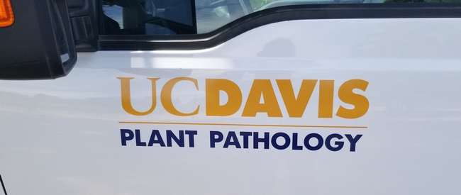 UC Davis Plant Pathology name and logo on side of a truck