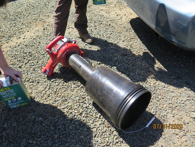 A modified leafblower with a bucket on the end to collect insects.