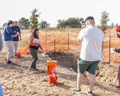 Professor Elizabeth Mosqueda (in orange shirt) instructs her students at the soil pit in the Master Gardeners' Three Sisters Garden. (Photos: Sarah Del Pozo)