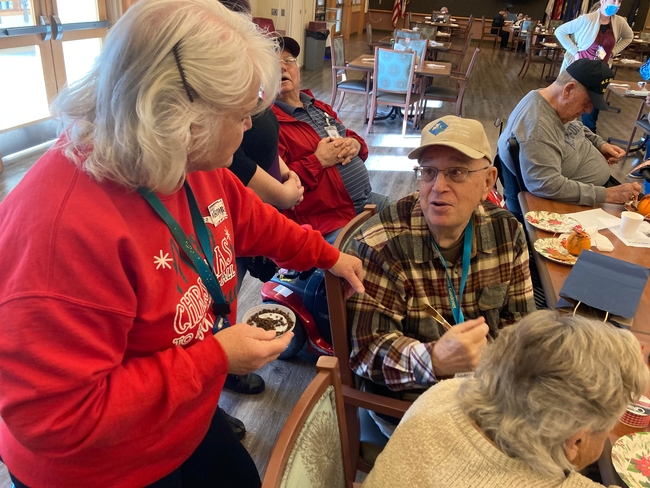 MGs Richard Hardwick (right) and Jean Gerdes at the Cal-Vet holiday event.