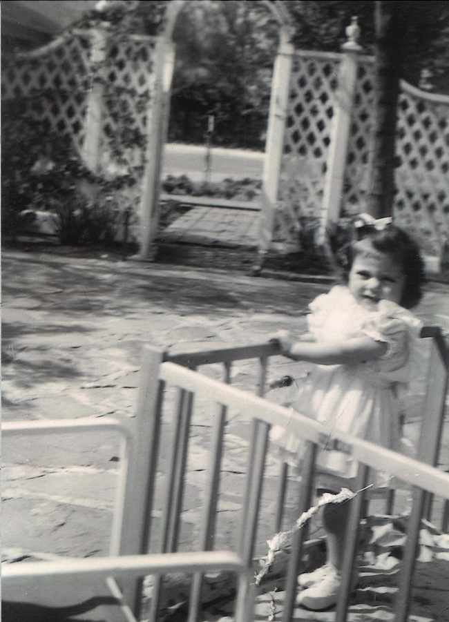Barbara as a toddler in the garden.