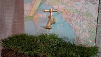 Water faucet mounted on an LA map