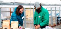 Katharina Ullman, Organic Agriculture Institute training and technical assistance coordinator, left, and field day participant view results of soil health test. for Green Blog Blog