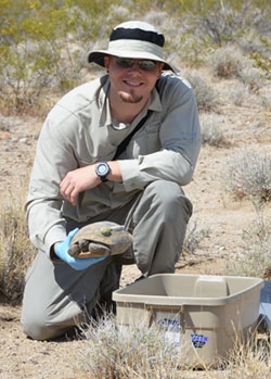 Professor Brian Todd, UC Davis, with a Mojave desert tortoise.