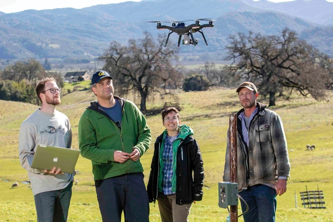 Professor Justin Brashares (center) and members of his lab utilize tagging, drones, and GPS technologies to track the movement of carnivores and their prey. PHOTO: Jim Block.