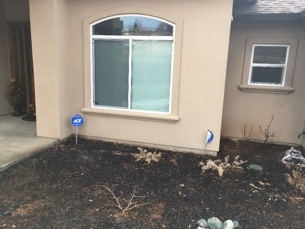 This house met new construction standards. It likely would not have been damaged if there had been a 5-foot zone around the home that did not contain combustible plants or other materials.