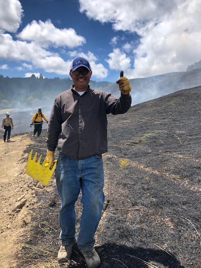 A new Humboldt County PBA participant enjoys his first prescribed burn in June 2019. (Photo: Lenya Quinn-Davidson)