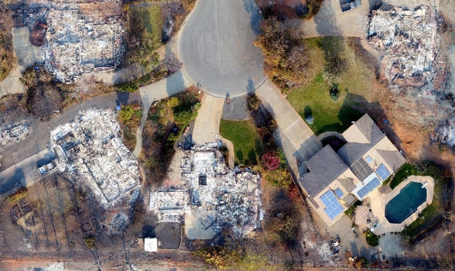 tThis photo captured by a drone shows a house that survived the 2018 Camp Fire among others that were destroyed. Photo courtesy of Butte County