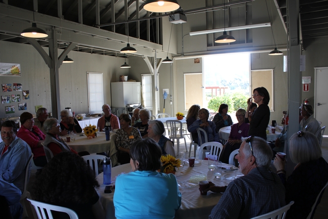 Susana Bruzzone-Miller, Education Outreach Coordinator speaks to group