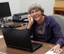 Master Gardeners answer helpline calls in the office