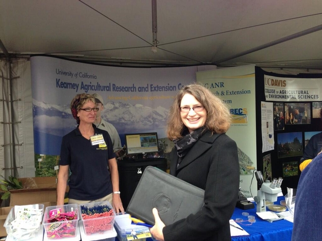 Vice President, Director of Agricultural Experiment Station, Director of Cooperative Extension, and Professor and Russell Rustici Chari in Rangeland Management, Barbara Allen-Diaz visiting Staff Research Associate, Julie Sievert, at the UC ANR KARE & REC System Booth.