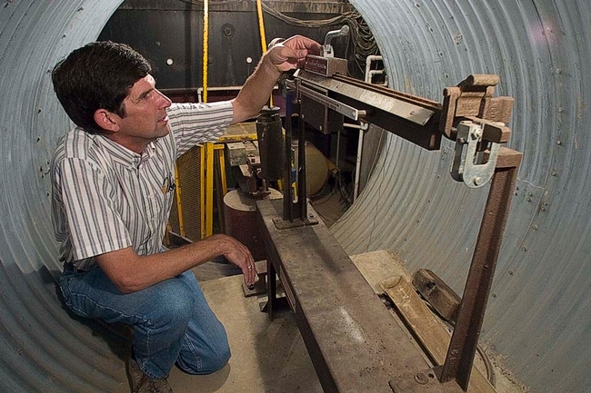 Scott Johnson in the underground access chamber of the weighing lysimeter.