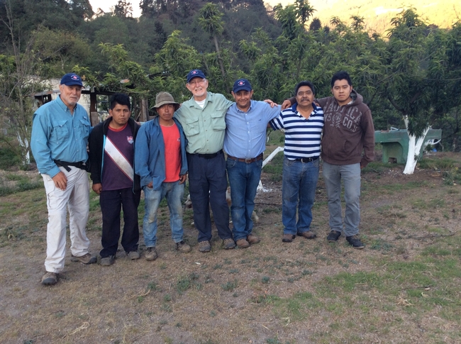 Jay Brunner (far left), Walter Bentley and Armando Hernandez (center), with family members from one of the Guatemalan farms visited in April, 2016.