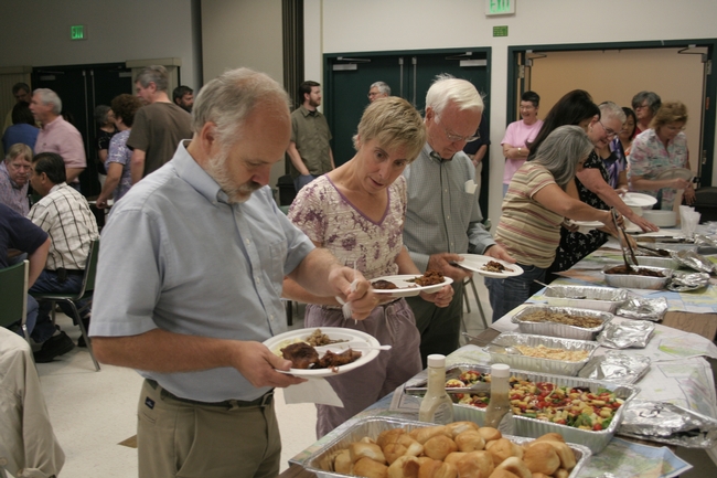 John and his wife Marcia lead the buffet line.