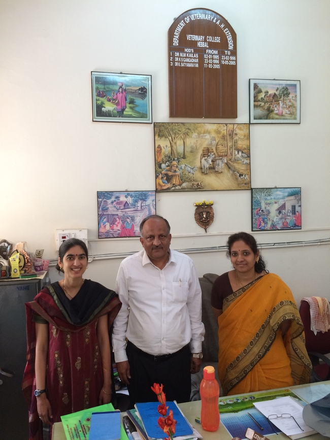 (left to right) Devii Rao, Dr. K. Satyanarayan and Dr. Jagadeeswary at the Veterinary University in Bengaluru with beautiful scenes of agricultural life depicted above us on the wall.
