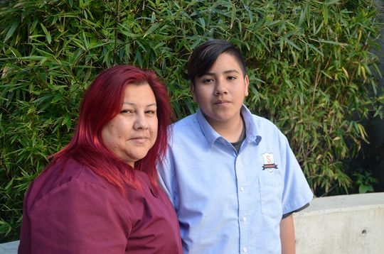 Adrian Mejia and his mother, Saira Diaz, learned healthier eating habits through a study at the University of Southern California and Children's Hospital Los Angeles. He gave up sugary drinks, lost some weight and joined a soccer team. Diaz joined the effort, losing 15 pounds and reducing her blood sugar. (Photo: Rob Waters for Kaiser Health News)
