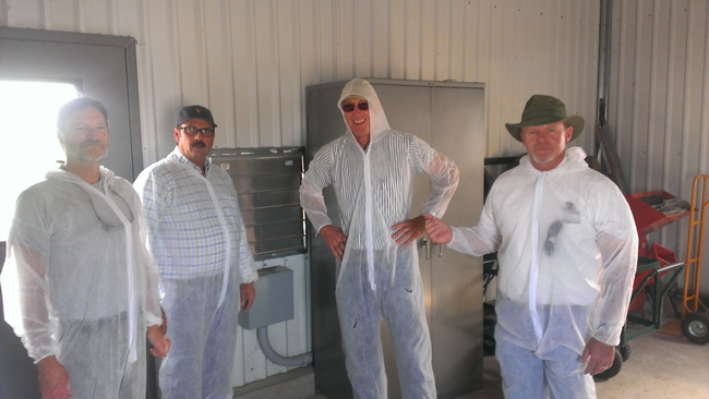 Nurserymen suit up for the protective structures tour at LREC