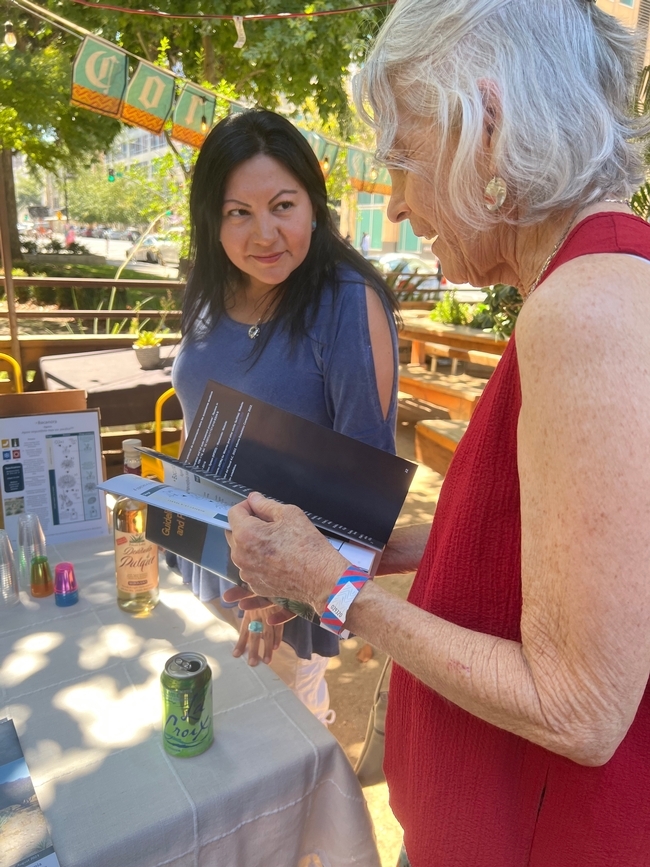 Silvia Almaraz, Agua Miel Distillate representative, and Louise Jackson, Emeritus Professor in Cooperative Extension, discussing the research-based guide to growing agave in California
