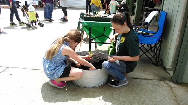 Myah working with youth to plant