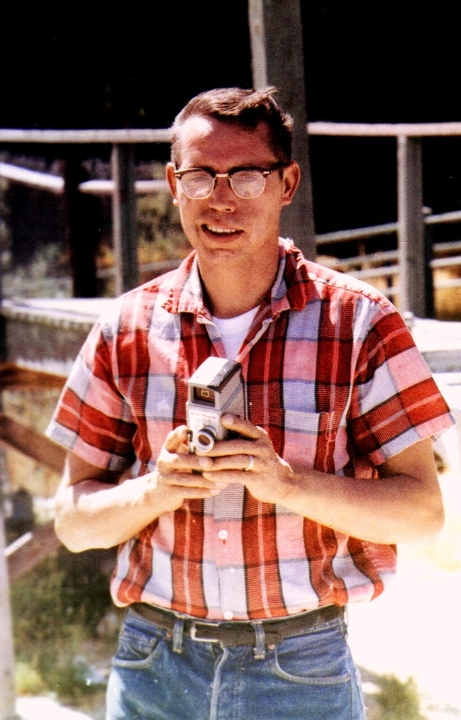 Daniel Martinez, father of Master Gardener, Michele Martinez, holding a super 8 film camera in the 1960s.